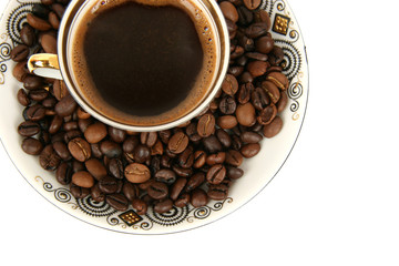 a lot of beans around a couple of coffee