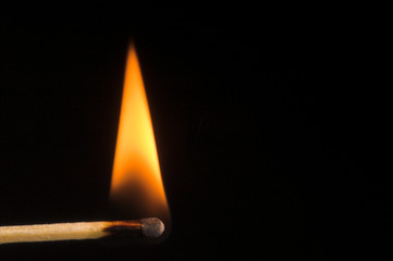 Image of a wooden kitchen match as it burns.