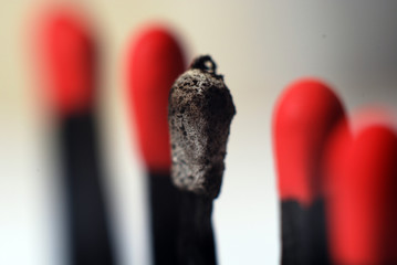 burnt member in business team represented by matches