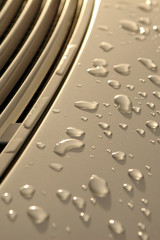 raindrops on luxury car metallic paintwork