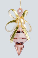 Old fur-tree toy on a grey background