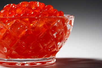 Fresh red caviar in beautiful crystal utensils