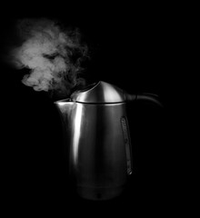 boiling water in a silver tea kettle