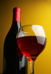 Still-life with glass and bottle of red wine