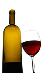 Glass and bottle of red wine isolated over white background
