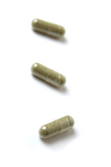 Vitamin or medicine capsules on a white background