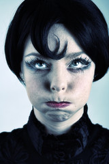 Stylish portrait of a blond girl making funny face