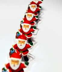 six red santa Claus on a light background