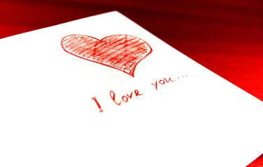white envelope with red heart on red background
