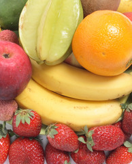 fresh color fruits background with banana and strawberries