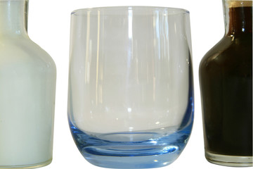 Two small decanters whith milk and coffee.