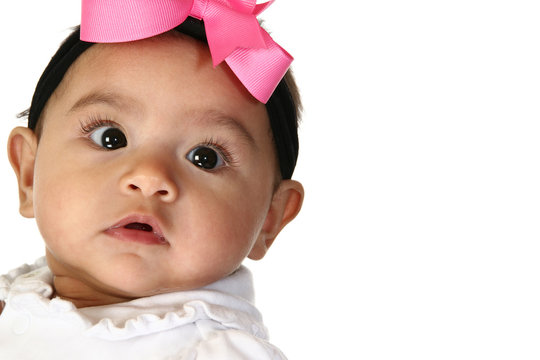 Close up of beautiful Hispanic 3 month old baby girl.
