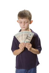 Young Boy Holding Cash Money In Front Of Himself