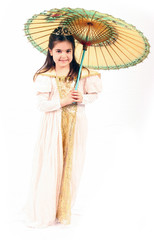 little girl in cute wedding dress holding an umbrella