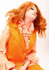 orange plastic fashion woman in red and auburn beauty hair