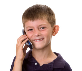 Young boy on a cell phone happy