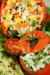 Delicious stuffed zucchini, pepper and tomato with side salad.