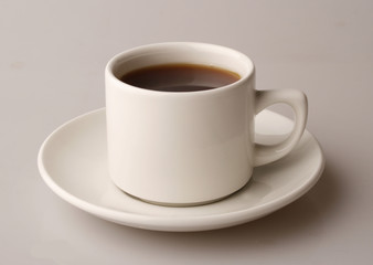 tea in wnite cup over background