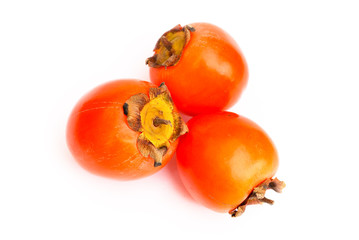 Close up three tropical sharon fruits isolated on white