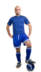 Fototapeta premium A male soccer player. Studio shot over white.