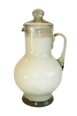 Jug filled by milk on a white background