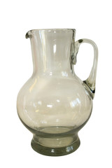 Transparent empty jug isolated on a white background