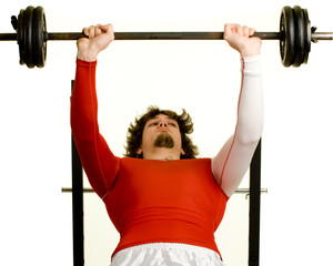 A young man lifting weights over a white background.