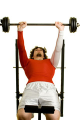 Fototapeta premium A young man lifting weights over a white background.