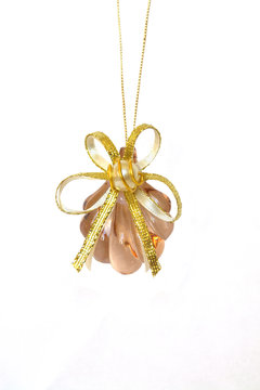 beautiful glass decoration with golden bow and pearl isolated 