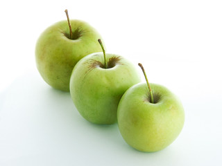 Three green apples isolated on white