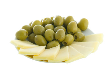 Olives and cheese on a plate isolated on white