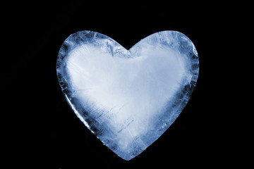 An ice cold blue heart. Over black.