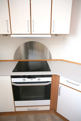 Fototapeta premium In a modern kitchen el cooker with ceramic plate