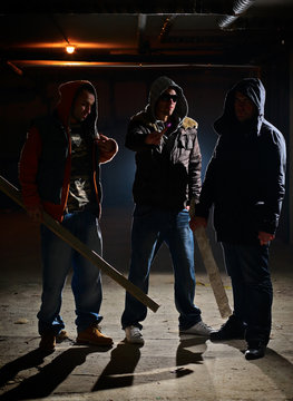 Gang members in a dark alley
