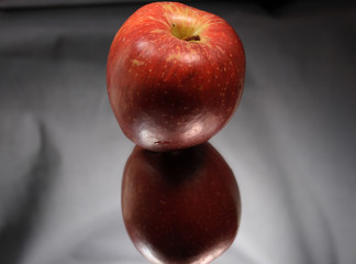 Red apple on glass