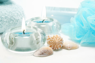 Spa essentials and skin care items in blue with sea shells