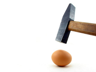 Hammer and egg isolated concept of power