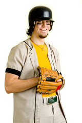 A young male baseball player standing.