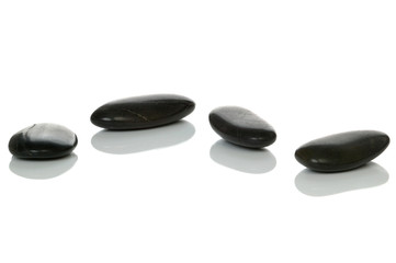 Four black pebbles.