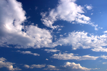 Naklejka na ściany i meble Beautiful white clouds on the blue sky - background texture