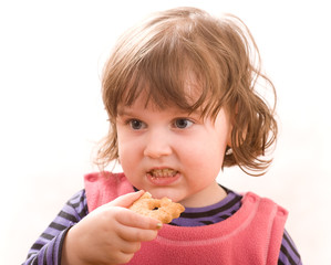 Small child eating cookies
