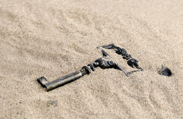 old key in sand