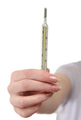 Thermometer in a female hand on a white background
