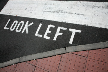 traffic  signs in a city painted on asphalt