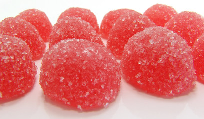Red fruit candy on a white background