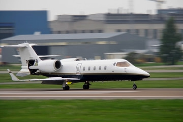 corporate jet landing at airport