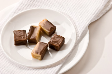 some chocolate candy on the white plate
