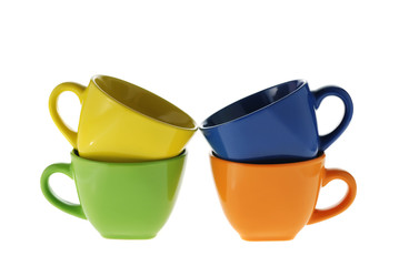 four color cups. Ceramic service from color cups