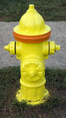 Fototapeta na wymiar Fire hydrant with orange stripe outdoors