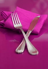 An elegant colorful table setting in pink